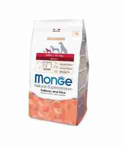 Bag of Monge Natural Superpremium Salmon and Rice pet food (adult, mini to 10 kg) with dog silhouettes on the label.