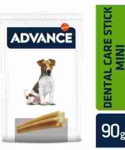 White dog-chew product bag labeled 'Advance' with a pictured brown-and-white dog and chewed sticks; green vertical label reads 'Dental Care Stick Mini' and a dark blue '90 g' block indicates weight.